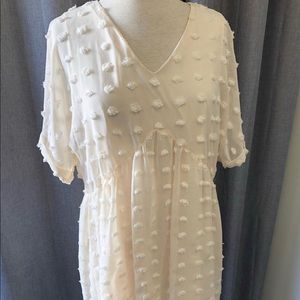 Dots for days! Beautiful cream colored dress.